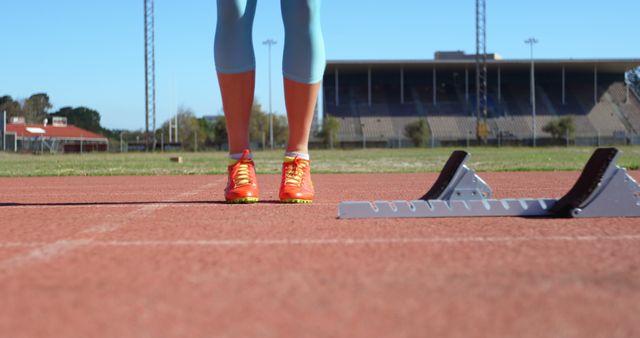 Athlete Preparing for Sprint Start on Outdoor Track - Download Free Stock Images Pikwizard.com