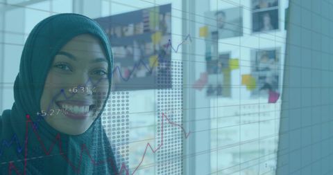 Businesswoman Celebrating Financial Success in Modern Office