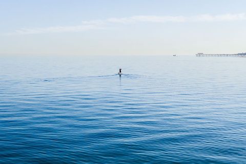 Peaceful Paddleboarding on Tranquil Blue Sea