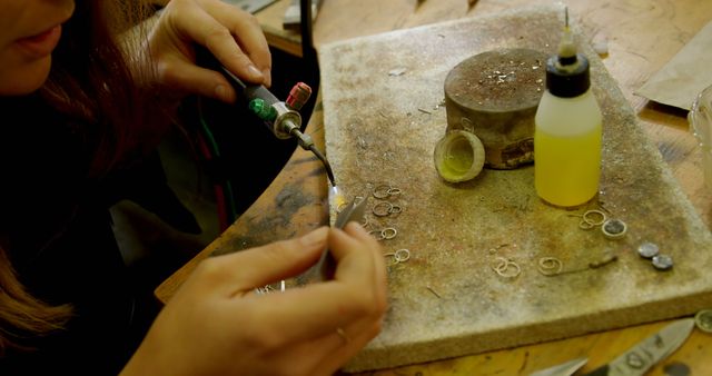 Jeweler Working with Soldering Iron on a Bench - Download Free Stock Images Pikwizard.com