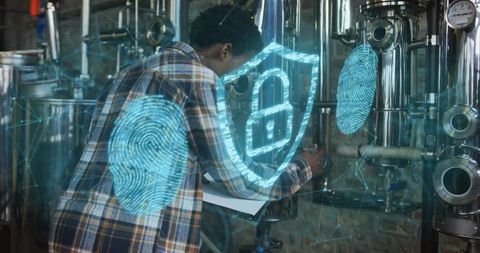 Black technician inspecting stainless plant with holographic fingerprint and padlock