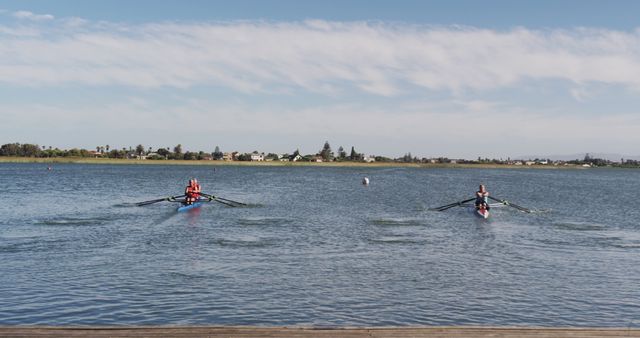 Two Rowers on Serene Lake on Clear Day with Blue Sky - Download Free Stock Images Pikwizard.com