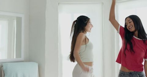 Diverse Friends Dancing in Bright Minimalist Bedroom