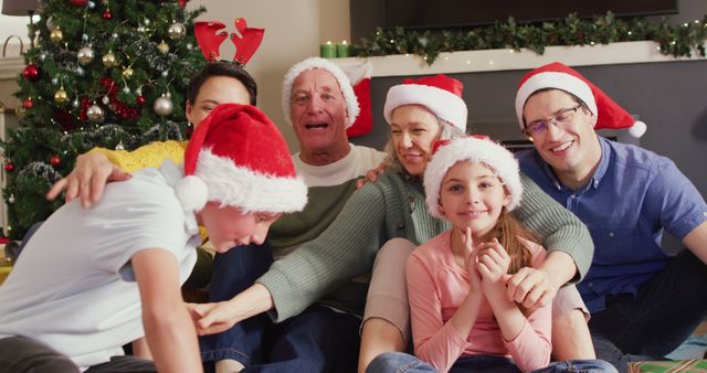 Family Celebrating Christmas Together at Home with Santa Hats - Download Free Stock Images Pikwizard.com