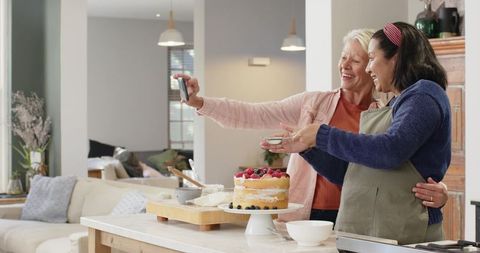 Diverse Senior Friends Sharing Baking Experience in Cozy Kitchen