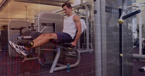 Athletic man performing leg extensions on gym machine with fitness data overlay, strength
