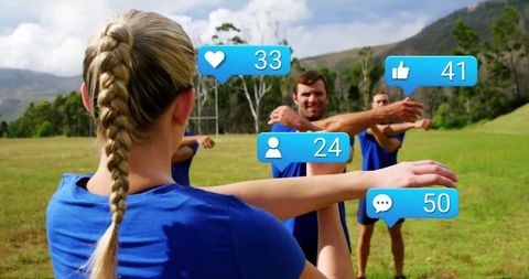 Athletic Team Stretching with Social Media Engagement Concept
