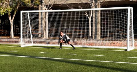 Goalkeeper Standing Alert in Front of Soccer Goal During Practice - Download Free Stock Images Pikwizard.com