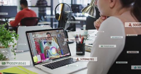 Female employee viewing online presentation on color wheel