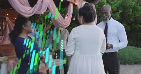 Intimate outdoor wedding vow exchange under pink canopy at dusk with groom holding ring