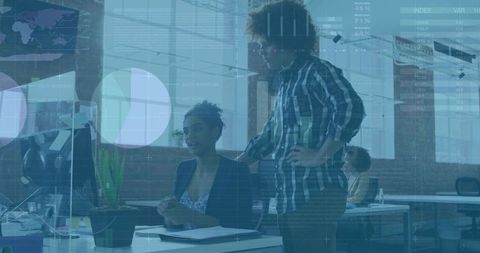 Corporate Officers Analyzing Data on Office Computer