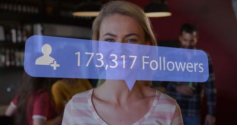 Social Media Follower Count Over Smiling Woman in Bar