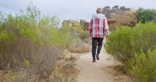 Person Hiking on Nature Trail with Rocky Landscape - Download Free Stock Images Pikwizard.com