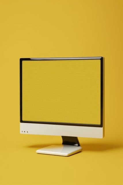 Vintage computer monitor set against vibrant yellow background offering retro technology feel. Great for tech nostalgia pieces, vintage design concepts, minimalist presentations, and advertisements showcasing vintage electronic themes or designs.