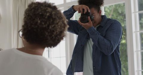 Wedding photographer capturing intimate moments of celebrated couple