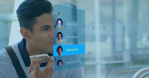Commuter Using Voice Assistant With Holographic Contact List in Modern Transit Hub