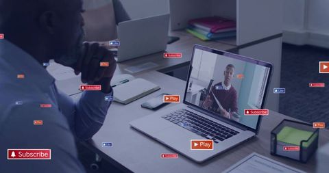 Professional watching webinar on laptop with play and subscribe overlays for remote collaboration