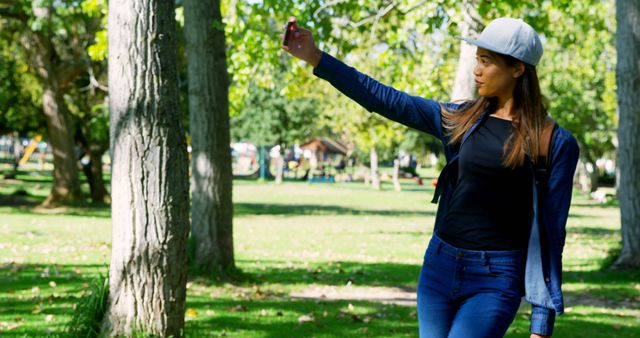 Young Woman Taking Casual Outdoor Selfie in Park - Download Free Stock Images Pikwizard.com