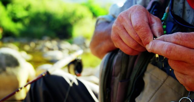 Senior Fisherman Tying Fishing Knot Outdoors - Download Free Stock Images Pikwizard.com