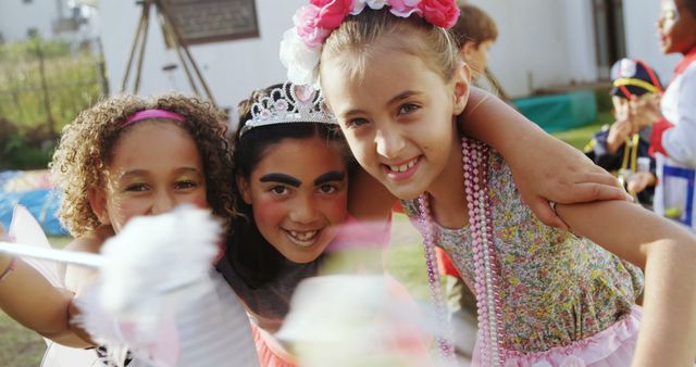 Joyful Girls Celebrating at Outdoor Event with Festive Attire - Download Free Stock Images Pikwizard.com