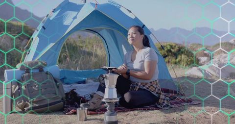 Peaceful Woman Enjoying Camping Adventure with Coffee Setup