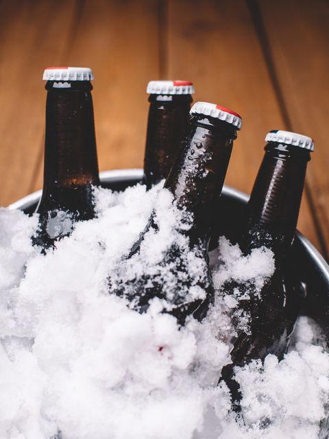 Ice-Cold Bottled Beers in Metal Tub Covered with Snow - Download Free Stock Photos Pikwizard.com