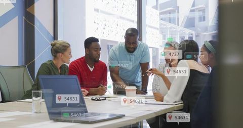 Diverse team collaborating around table with digital UI overlays planning strategy