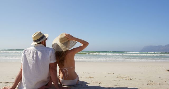 Romantic Couple Relaxing on Secluded Beach Vacation - Download Free Stock Images Pikwizard.com