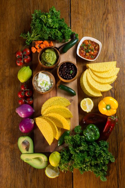 Assorted Mexican Food Ingredients on Wooden Table - Download Free Stock Photos Pikwizard.com