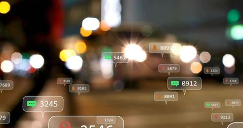 Urban night street featuring digital notification badges, bokeh lights, headlight flare