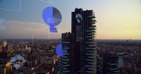 Dark glass skyscraper reflecting warm sunset with data hud overlays over city skyline