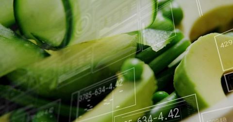 Merging fresh avocado, cucumber and peas with futuristic data overlays for smart nutrition