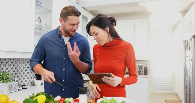 Caucasian Man and Asian Woman Cooking Together in Bright Home Kitchen - Download Free Stock Images Pikwizard.com