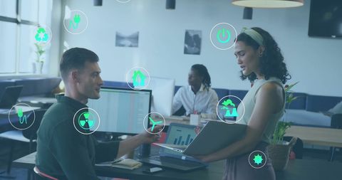 Eco-focused Tech Meeting with Diverse Colleagues in Modern Office