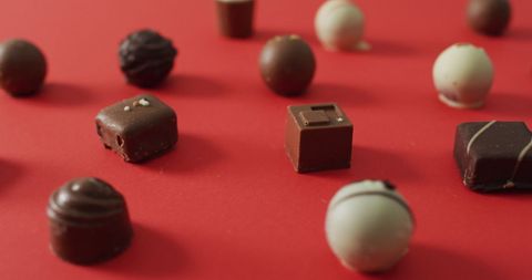 Assorted Chocolates on Vibrant Red Surface for Valentine's Day - Download Free Stock Images Pikwizard.com