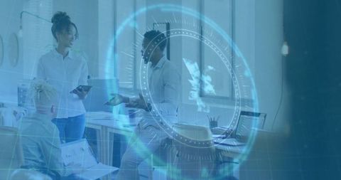 Office Team Collaborating in Modern Workspace with Digital Interface