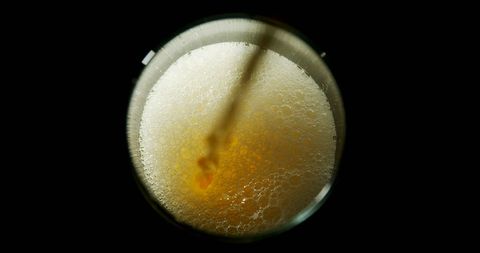 Top View of Beer with Foam Bubbles in Glass Against Black Background - Download Free Stock Images Pikwizard.com