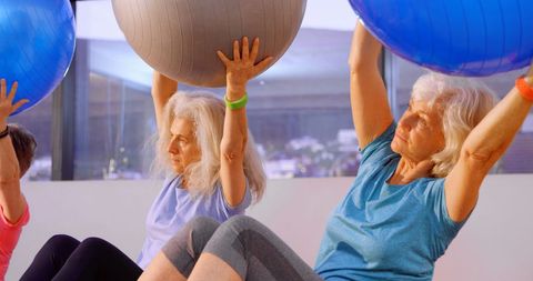 Senior Women Practicing Fitness Exercises with Stability Balls
