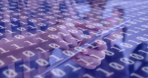 Person Using Tablet with Digital Binary Overlay