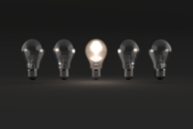 Transparent light bulbs with one glowing on dark background - Download Free Stock Videos Pikwizard.com