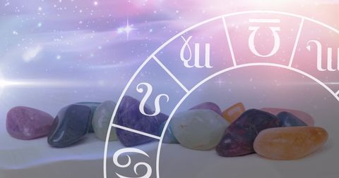 Zodiac symbols and healing stones on cosmic background