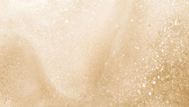 Champagne gold glitter bokeh backdrop with soft metallic sparkle