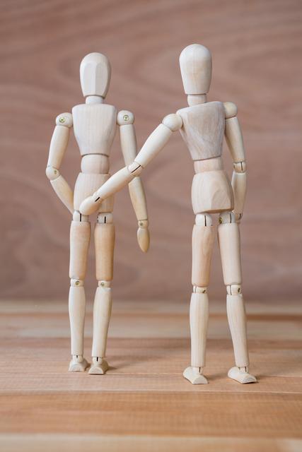Conceptual image of figurine couple standing together