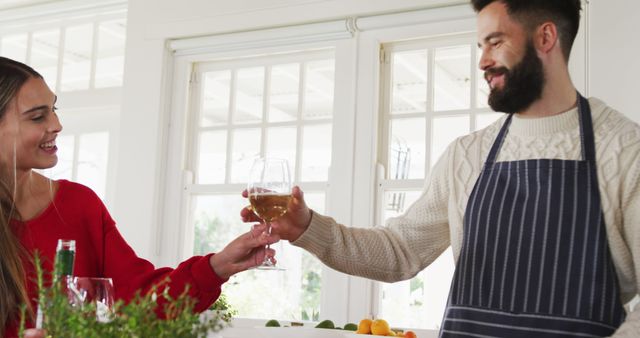 Couple Enjoying a Glass of Wine in Bright Modern Kitchen - Download Free Stock Images Pikwizard.com