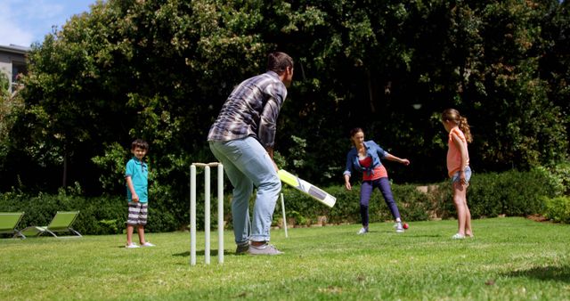 Family Playing Cricket in the Backyard on a Sunny Day - Download Free Stock Images Pikwizard.com