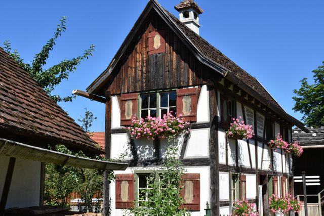 Rustic Half-Timbered House with Blooming Flower Boxes - Download Free Stock Photos Pikwizard.com