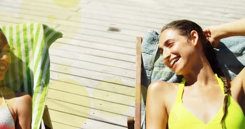 Sunny Day Relaxation: Friends Smiling on Sunbeds