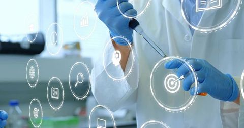 Lab technician pipetting orange reagent with augmented reality data overlay for research