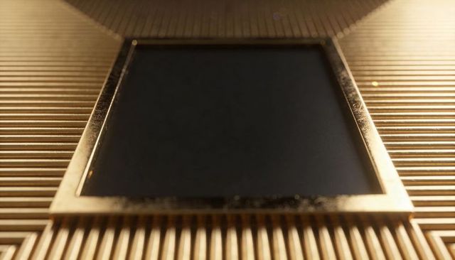 Gold bezel framed black sensor on ribbed metallic fins macro closeup