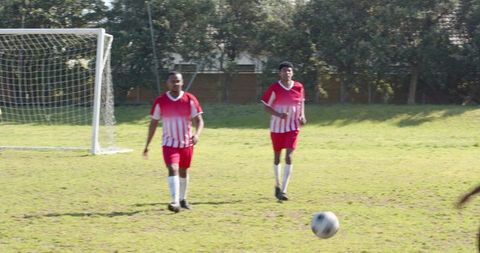 Teammates on soccer field preparing for match